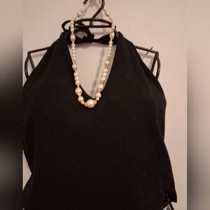 Elegant Black Halter Top with Pearl Necklace
